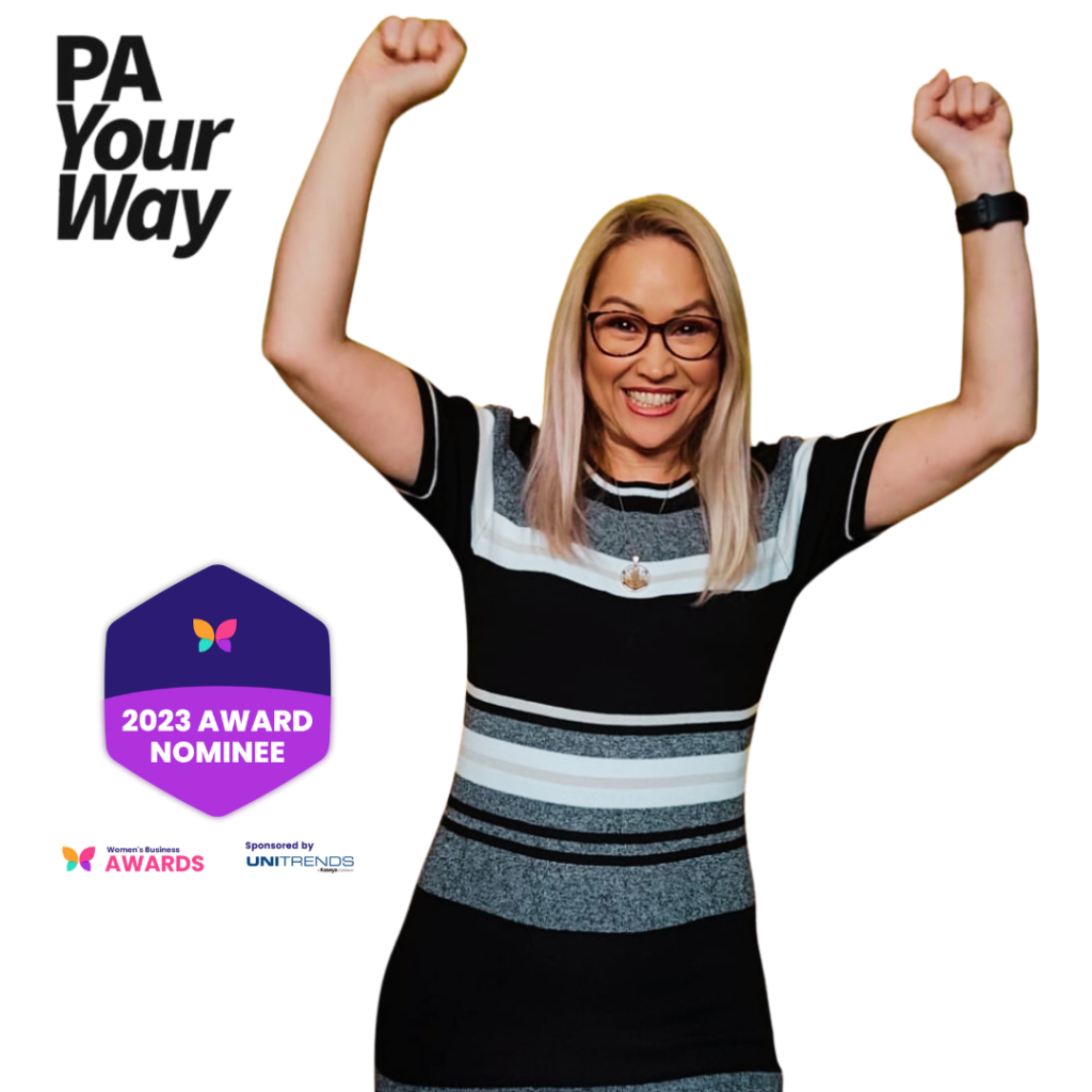 Viktoria celebrating an award nomination for Women's Business Awards, her hands in the air with PA Your Way logo and Women's Business Awards 2023 Award Nominee logo